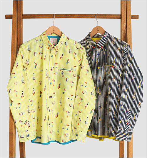 音色(ねいろ)［長袖シャツ］ (本体：綿100％／無地部分：ポリエステル80％・綿20％／刺繍糸：ポリエステル100％) 各20,900円  コラージュ風の音符が散りばめられたストライプシャツは、遊び心がありながらも上品なデザインで、大人のカジュアルスタイルにほどよい個性を添えてくれます。